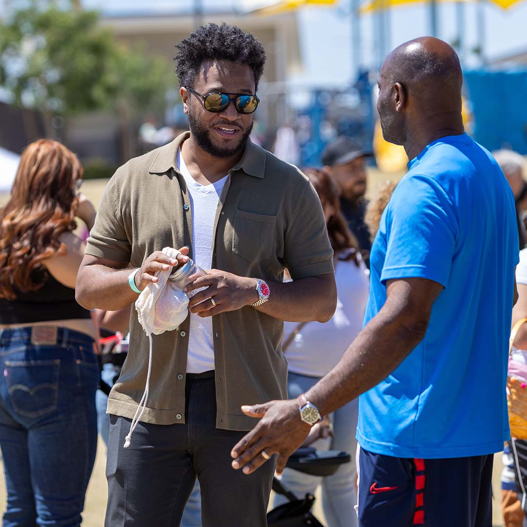 2 guys talking at spring event