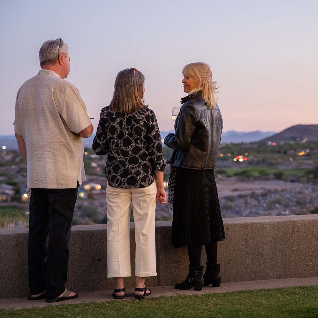 3 neighbors chatting while admiring the view