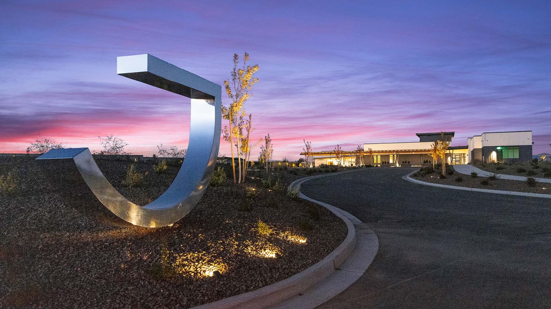 Jasper monument sign with J Club in background