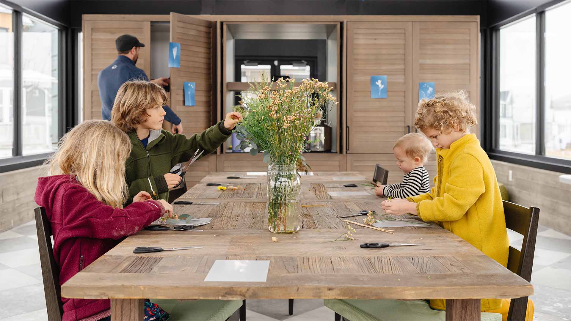 kids doing an activity at a table during an event at Terraine